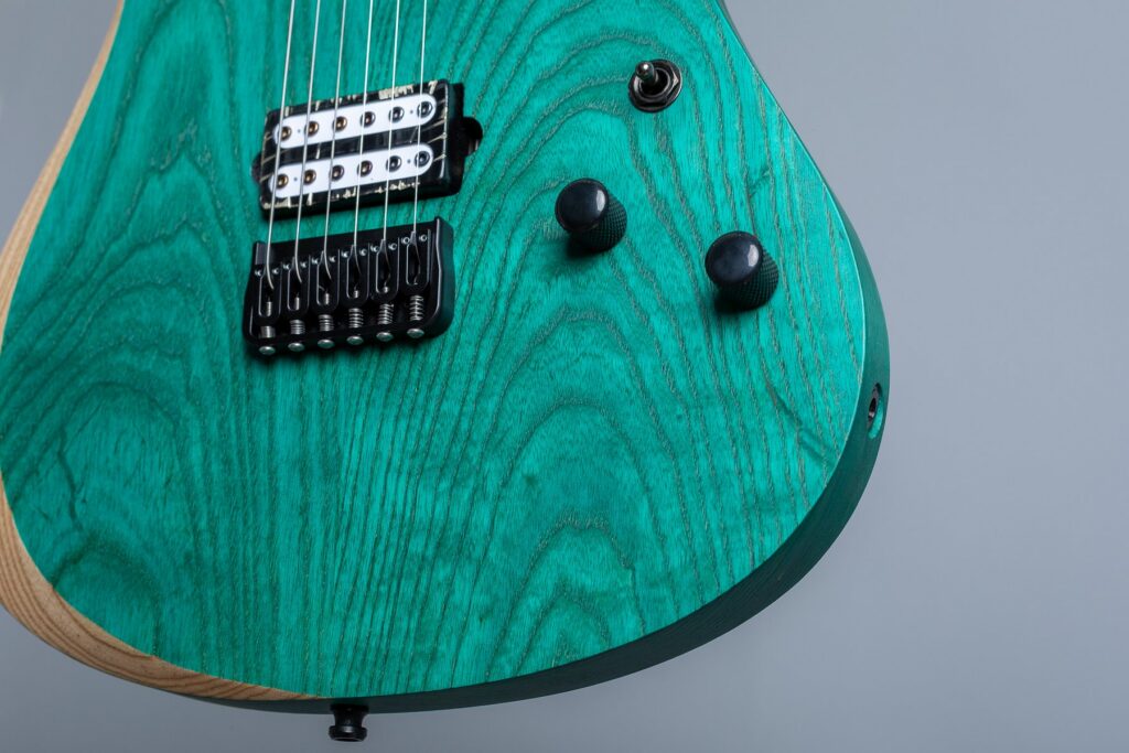 Green body of a Badstroke Fiend series guitar