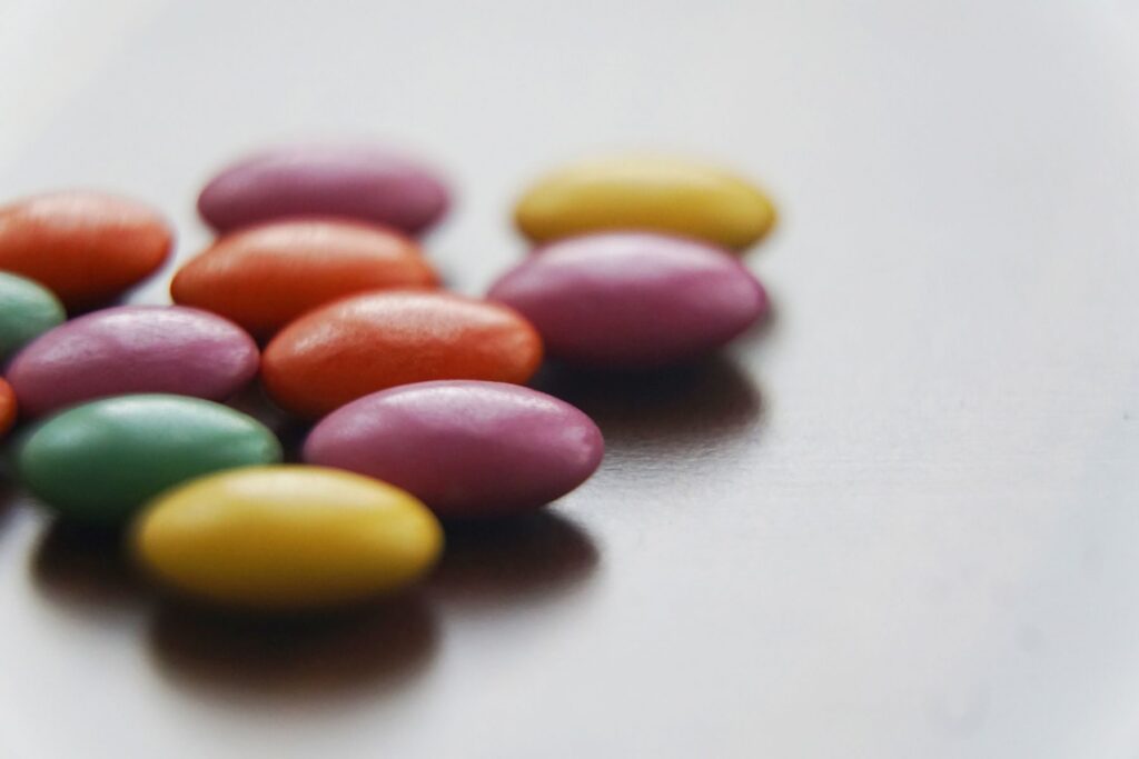 Candy-coated chocolates scattered on a table