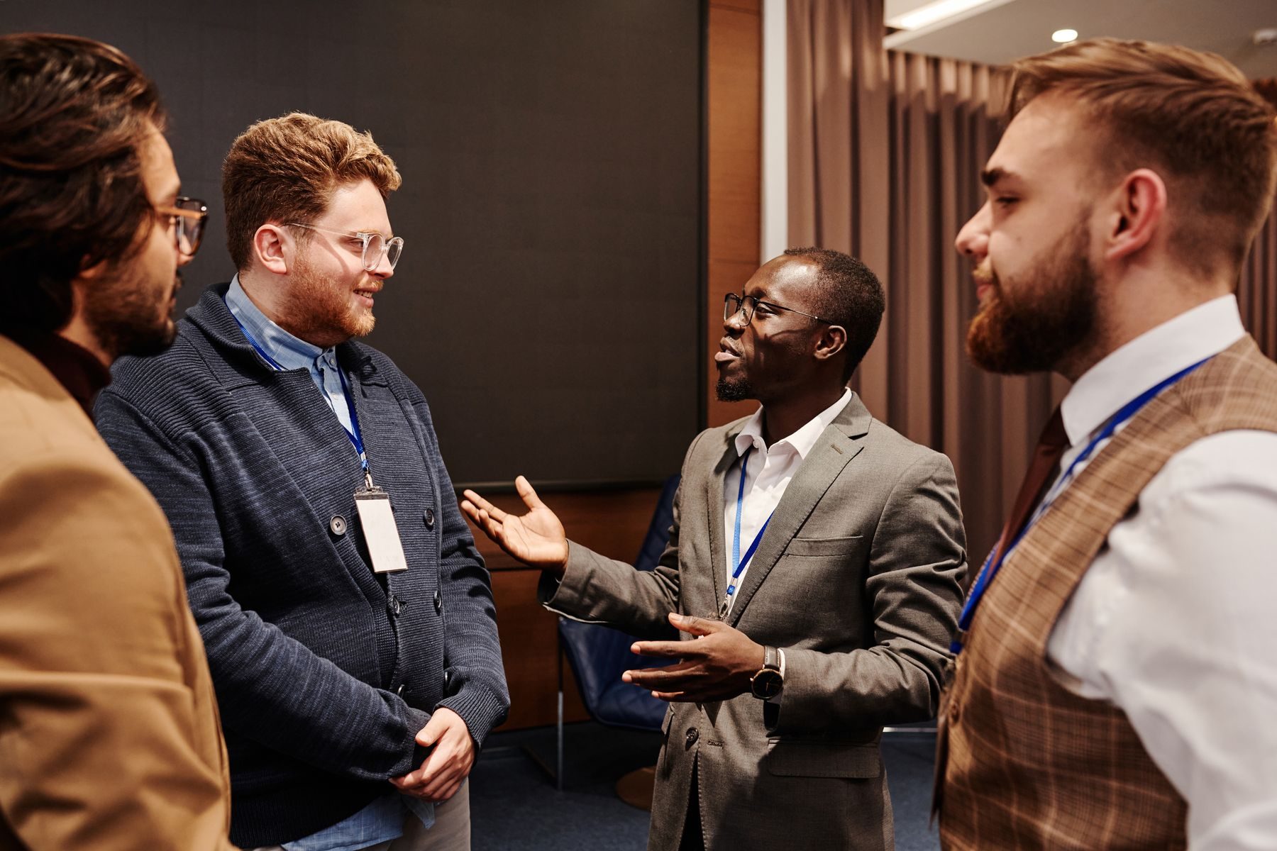 Four people talking at a business event